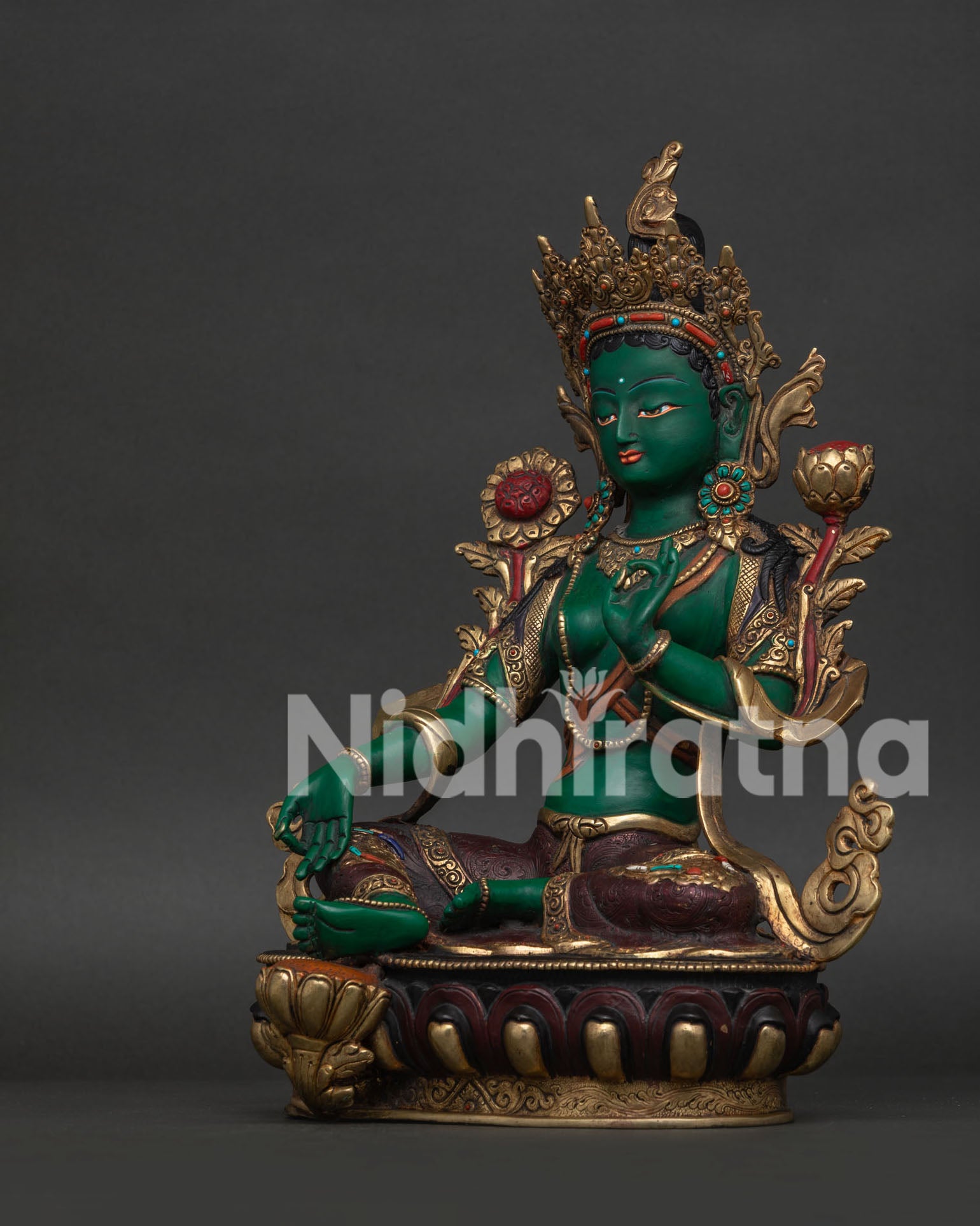 Handcrafted Green Tara Statue with Varada Mudra and Utpala Flower.