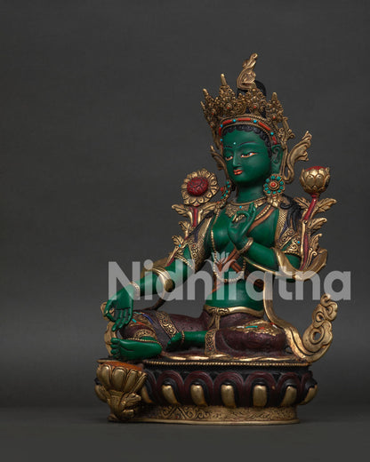 Handcrafted Green Tara Statue with Varada Mudra and Utpala Flower.