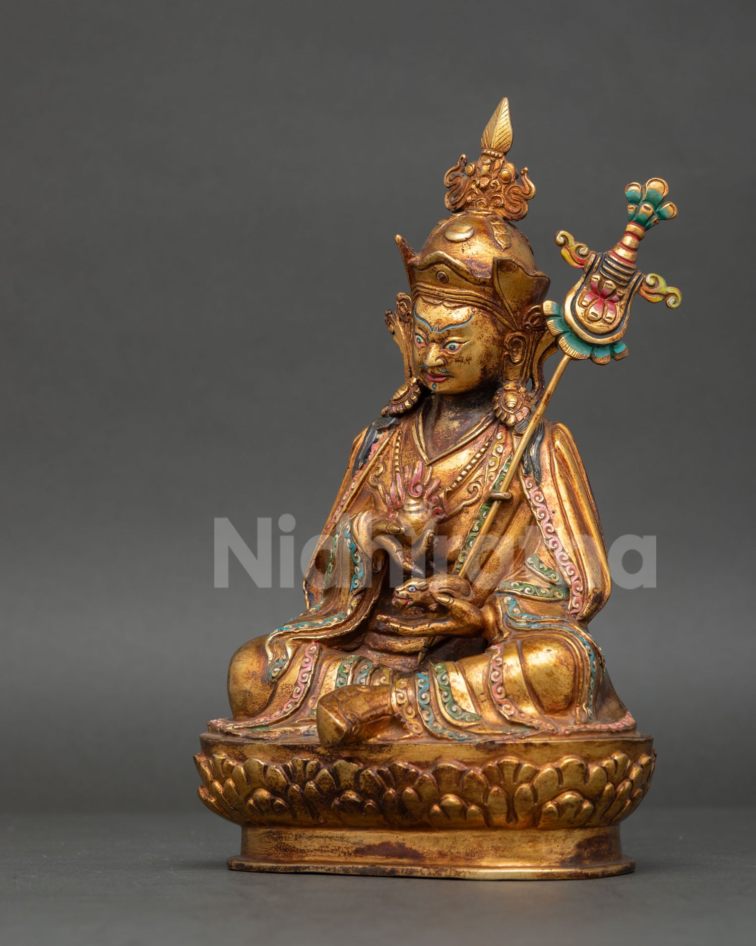 handcrafted guru norlha statue seated on lotus throne for buddhist altar and meditation