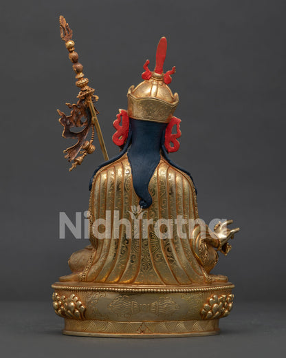 Handcrafted Guru Rinpoche Statue Back View with Floral Garments and Copper Body.