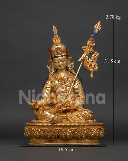 Handcrafted Guru Rinpoche statue from Patan Nepal with gold fire gilding and lotus pedestal.