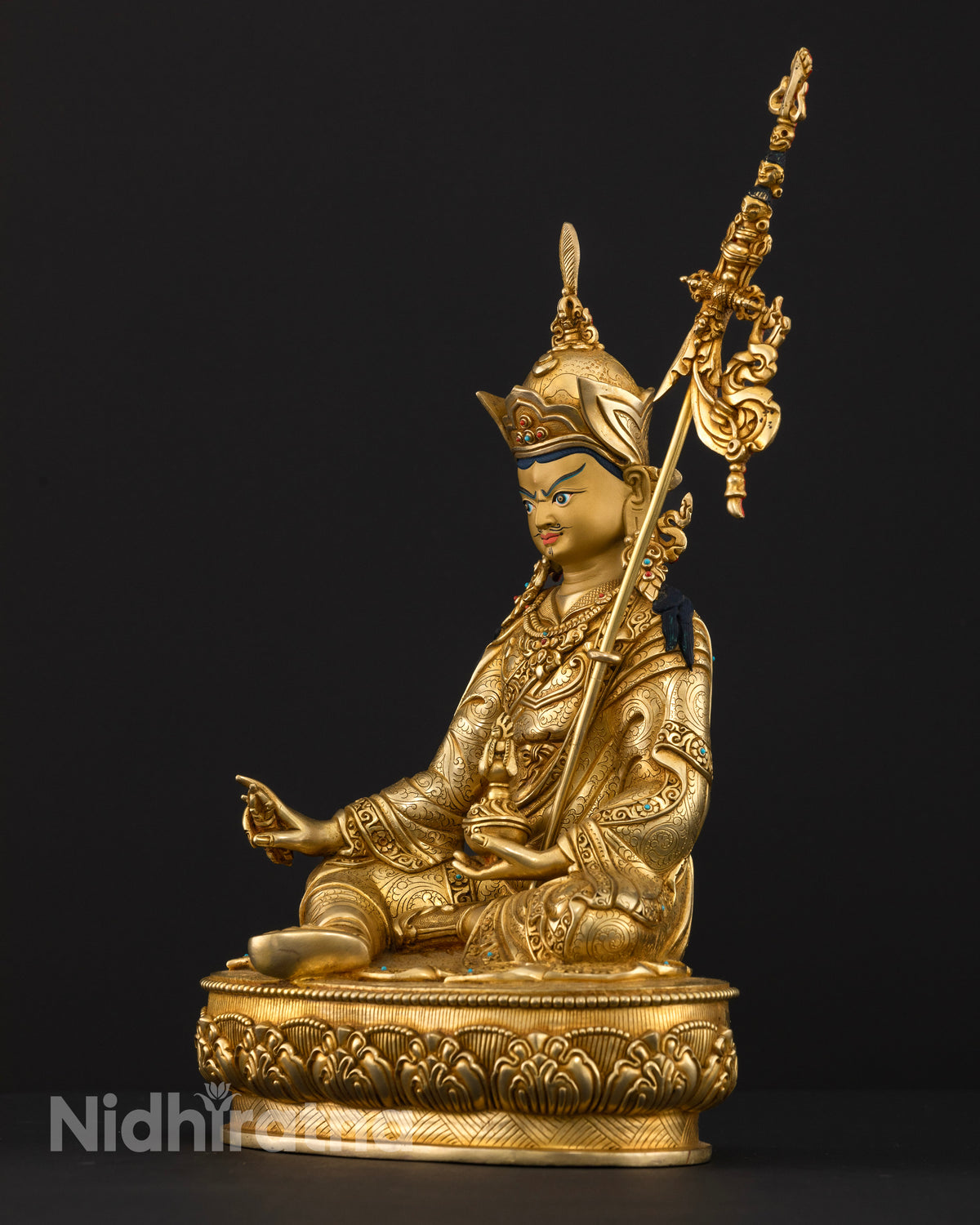 Handcrafted Guru Rinpoche Statue from Patan, Nepal with three dimensional carvings and lotus pedestal