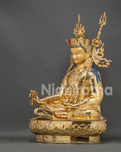 Handcrafted Guru Rinpoche statue left side view featuring elaborate ornaments and copper gold gilded finish