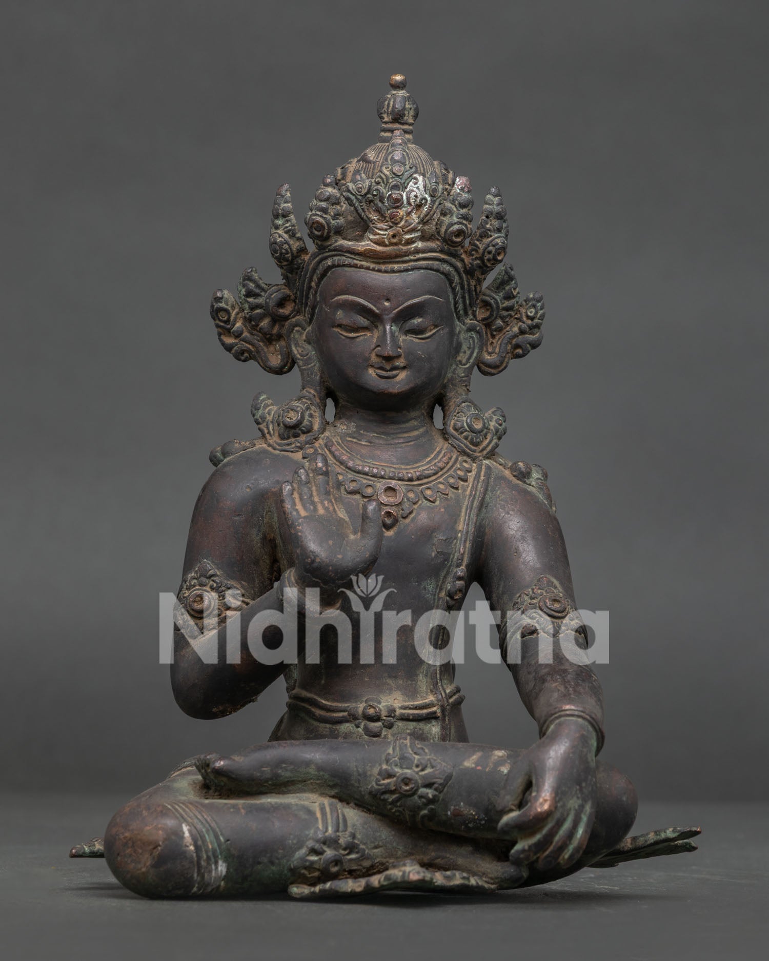 Handcrafted Lokeshvara statue from Patan Nepal with antique oxidized copper finish.