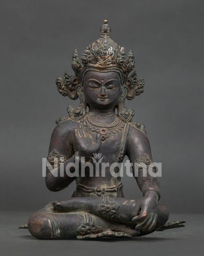 Handcrafted Lokeshvara statue from Patan Nepal with antique oxidized copper finish.