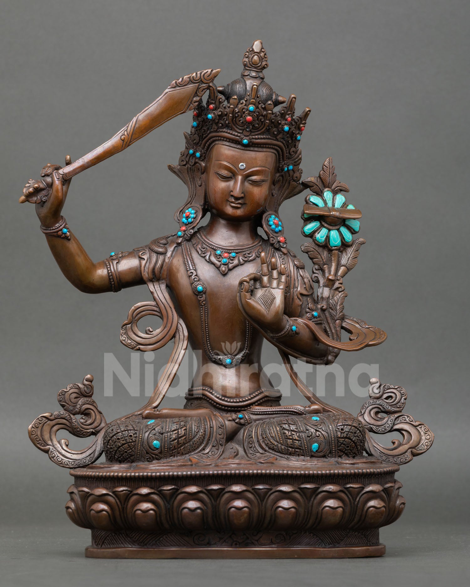 Handcrafted Manjushree Statue in oxidized copper with turquoise and coral stones, made by Newari artisan from Patan Nepal