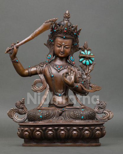 Handcrafted Manjushree Statue in oxidized copper with turquoise and coral stones, made by Newari artisan from Patan Nepal