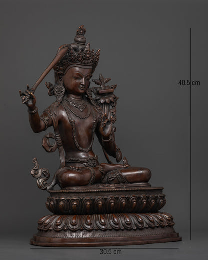 Handcrafted Manjushri Bodhisattva sculpture seated on a lotus pedestal with a flaming sword of wisdom.