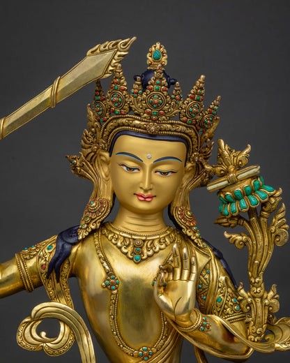 handcrafted Manjushri statue Nepal gold gilded Bodhisattva wisdom close up