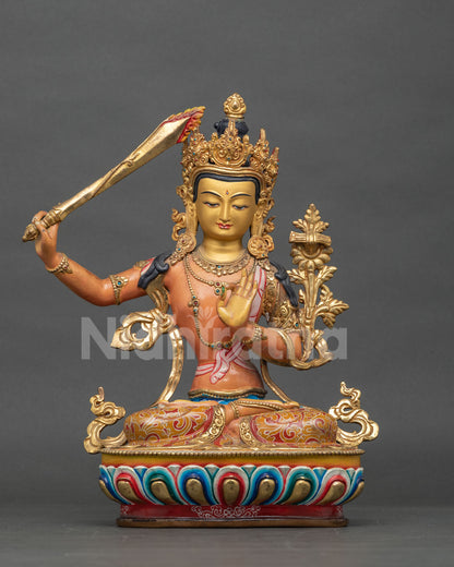 Handcrafted Manjushri statue with acrylic painted body and gold painted details.