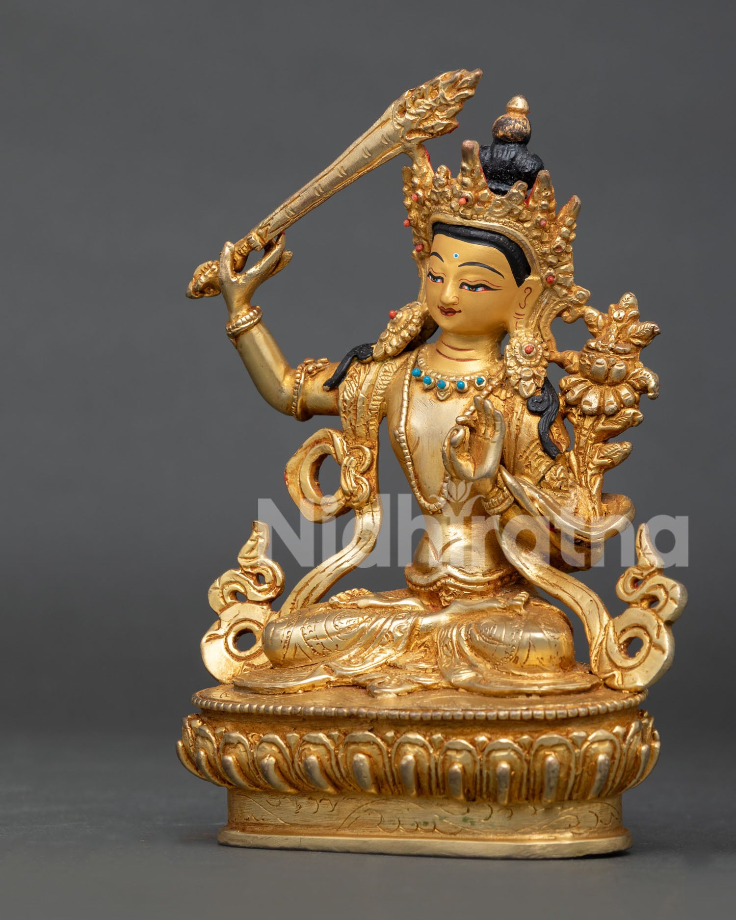 Handcrafted manjushri statue with gold gilded copper body from patan nepal.