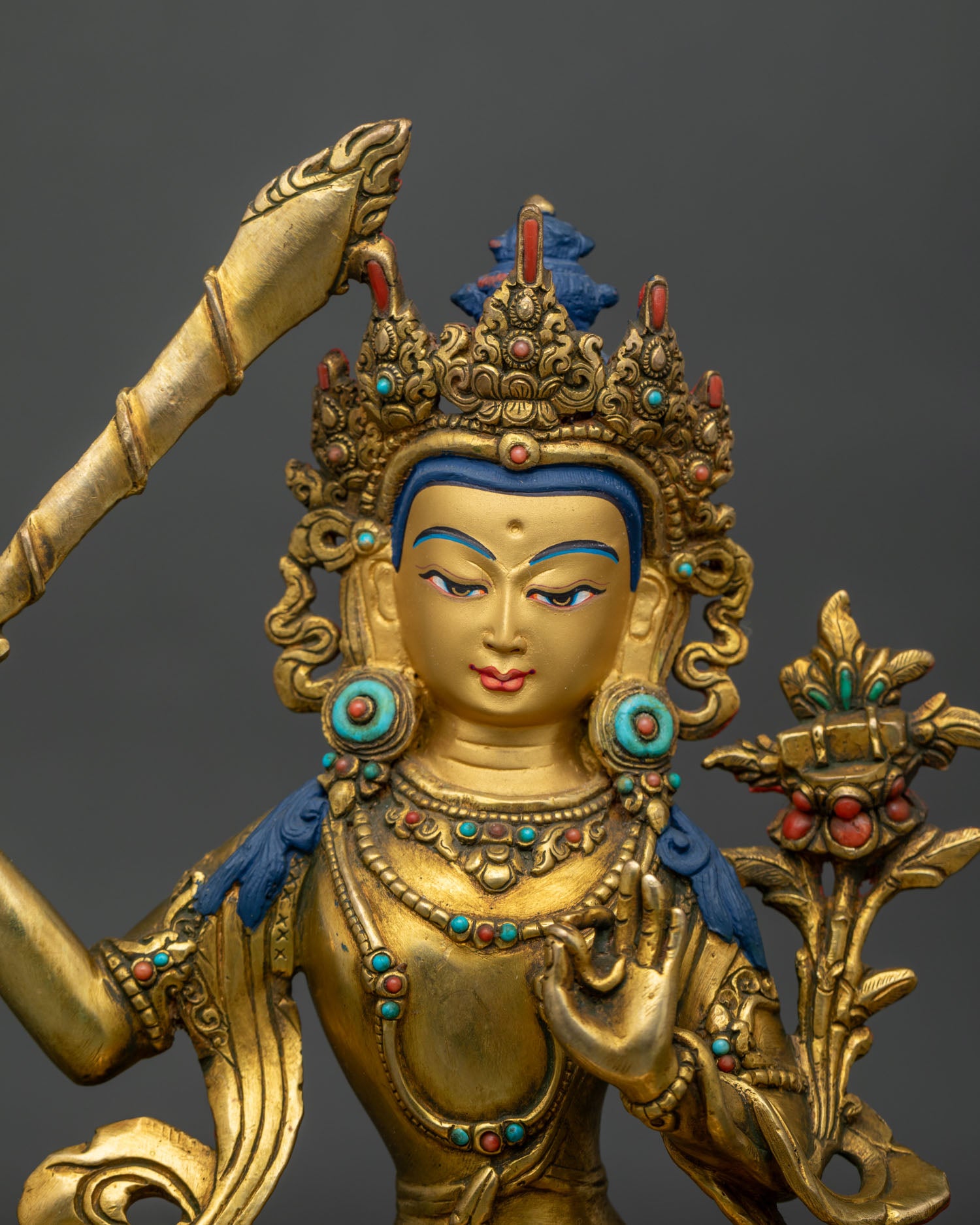 handcrafted manjushri statue with intricate gold gilding and detailed buddhist artistry