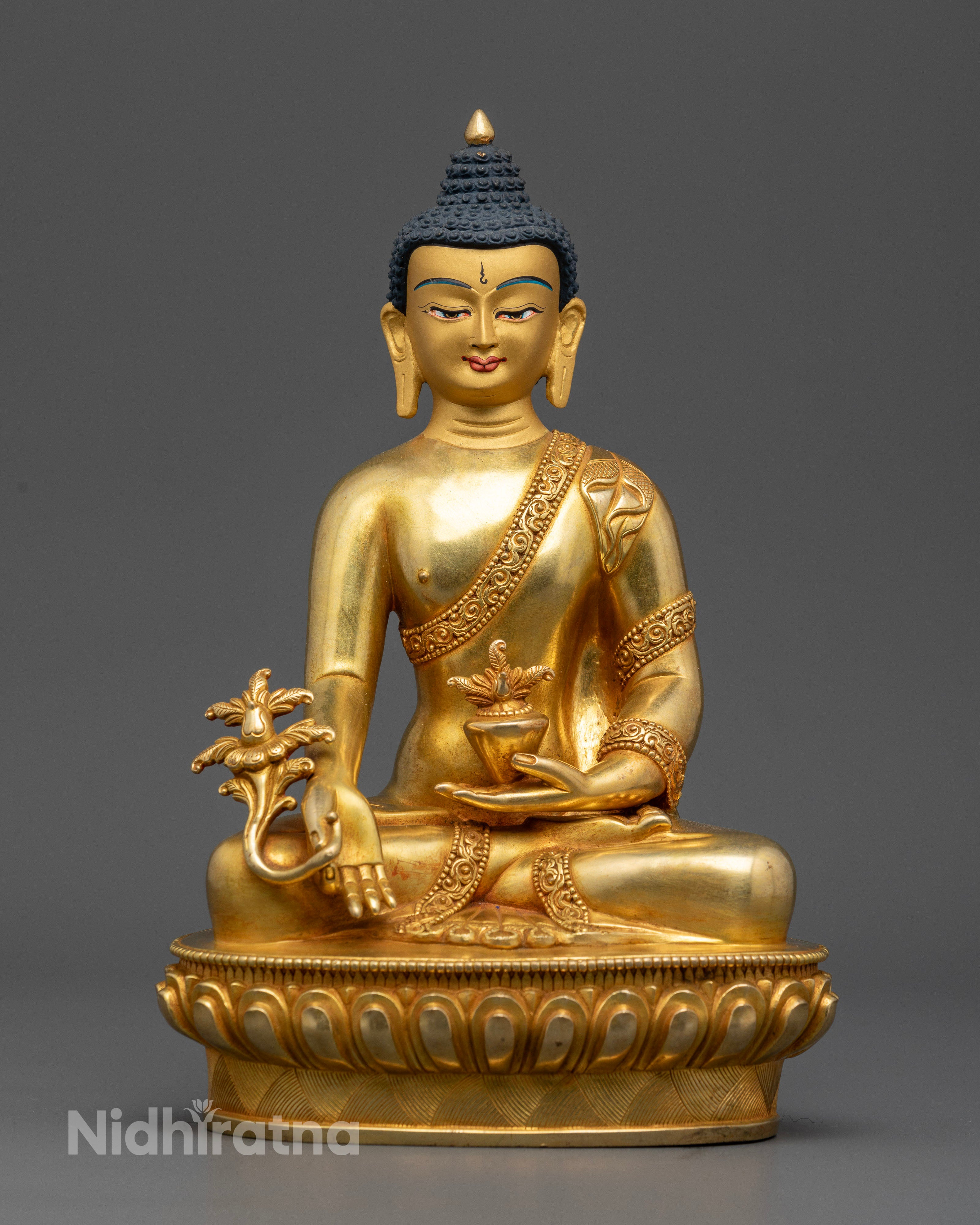 Handcrafted medicine buddha statue in gold gilded copper from patan nepal.