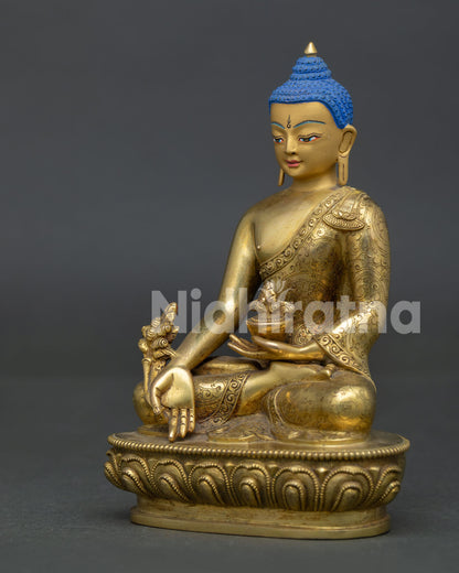 Handcrafted medicine buddha statue with gold gilded copper body from patan nepal.