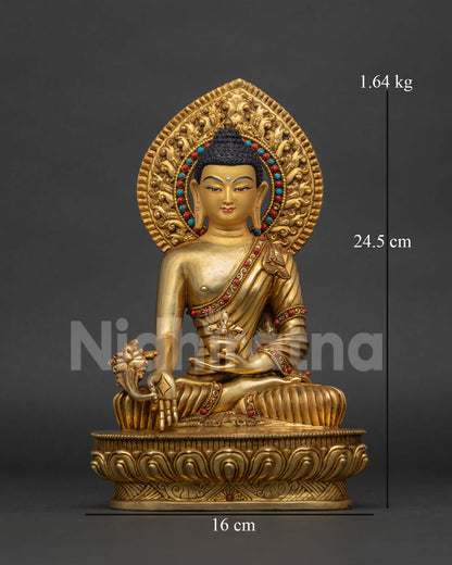 Handcrafted medicine buddha statue with semi precious stones and raised halo on lotus pedestal.