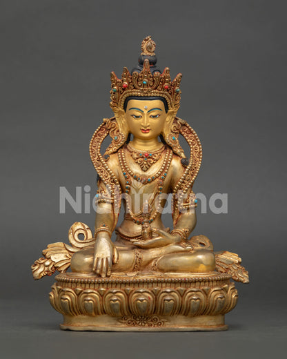Handcrafted Mitrugpa Buddha Statue with gold fire gilding, gold painted face, and Bhumisparsa Mudra, made in Nepal.