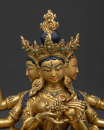 Handcrafted Namgyalma statue close up showing three faced expression gold painted face and semi precious stones.