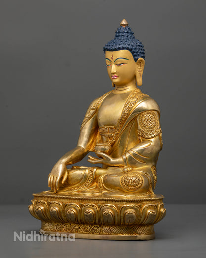 Handcrafted Nepalese Buddha sculpture with 24K gold gilding and Eight Auspicious Symbols