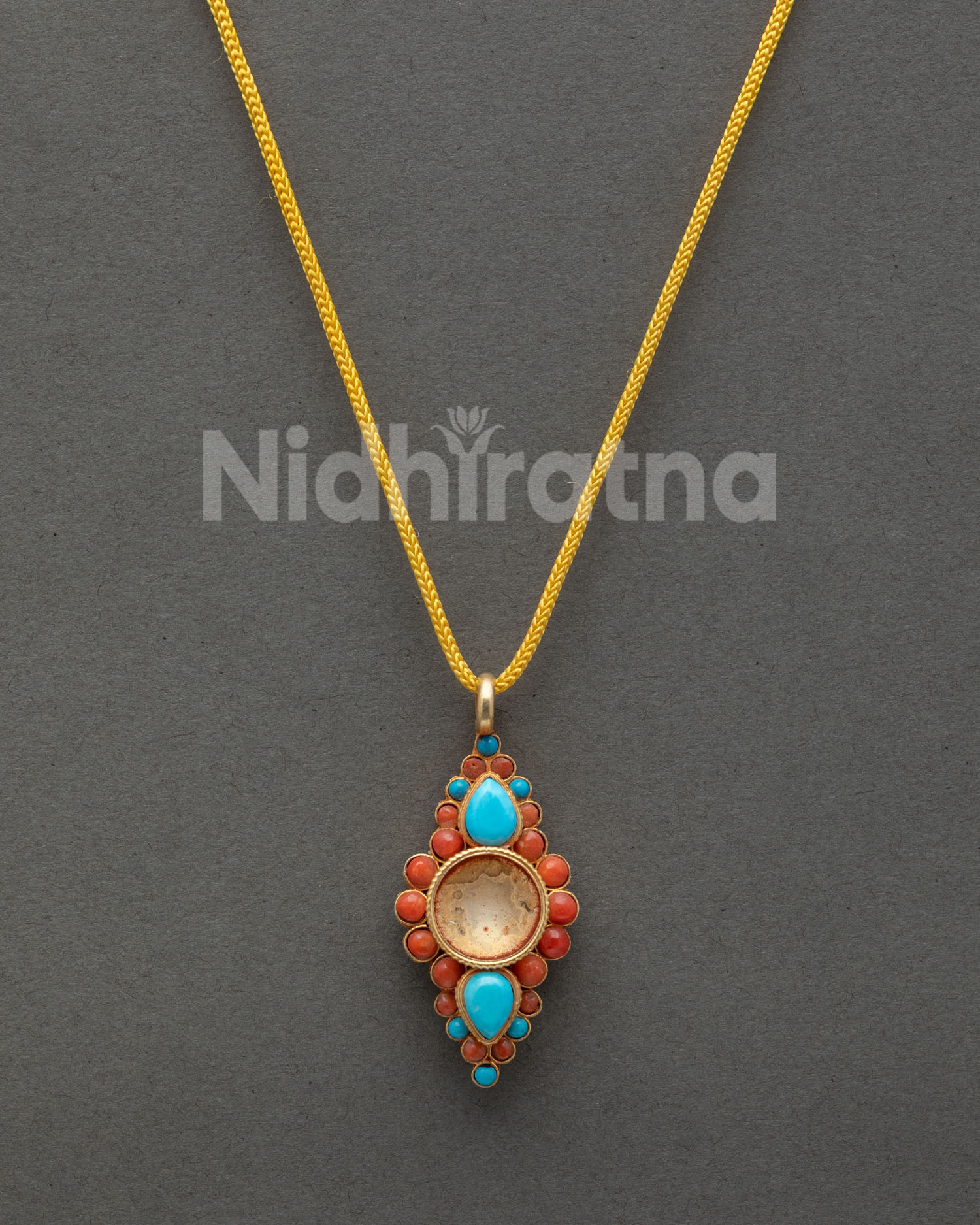 Handcrafted Nepalese flower locket with turquoise and coral gemstone detailing