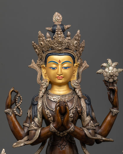 Handcrafted Nepalese Four Armed Chenrezig sculpture with gold-painted face and ornate details