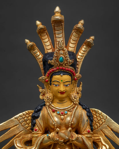 Handcrafted Nepalese Naga Kanya statue with 24K gold painted face and wings.
