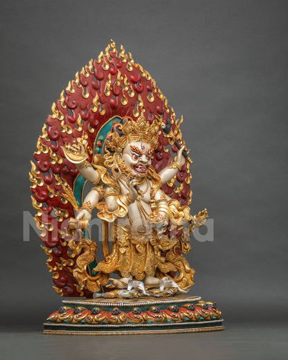 White Mahakala three-eyed face with bared fangs, wrathful gaze and turquoise and coral crown