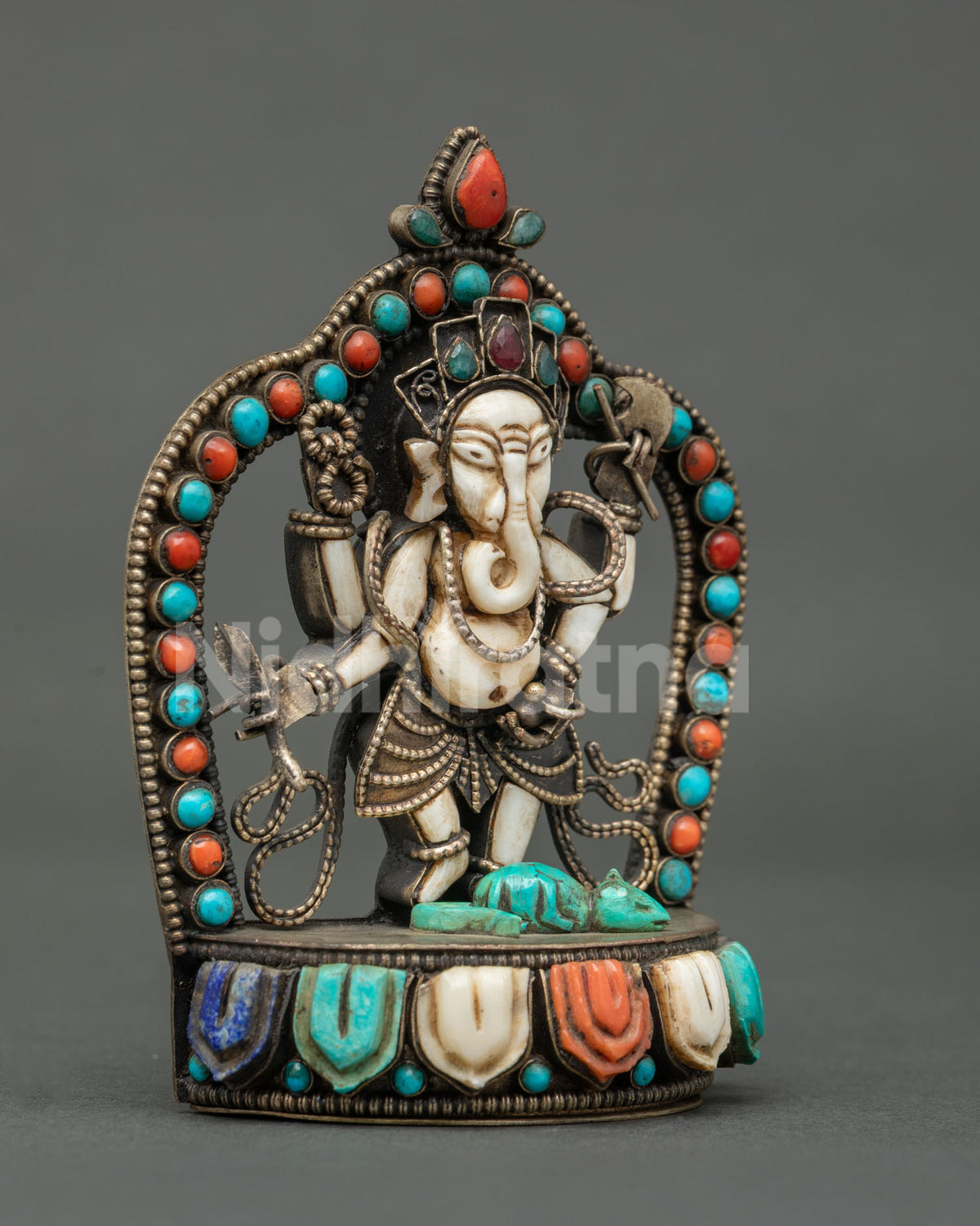 handcrafted newari ganesh statue in copper with gemstone halo and lotus base side view