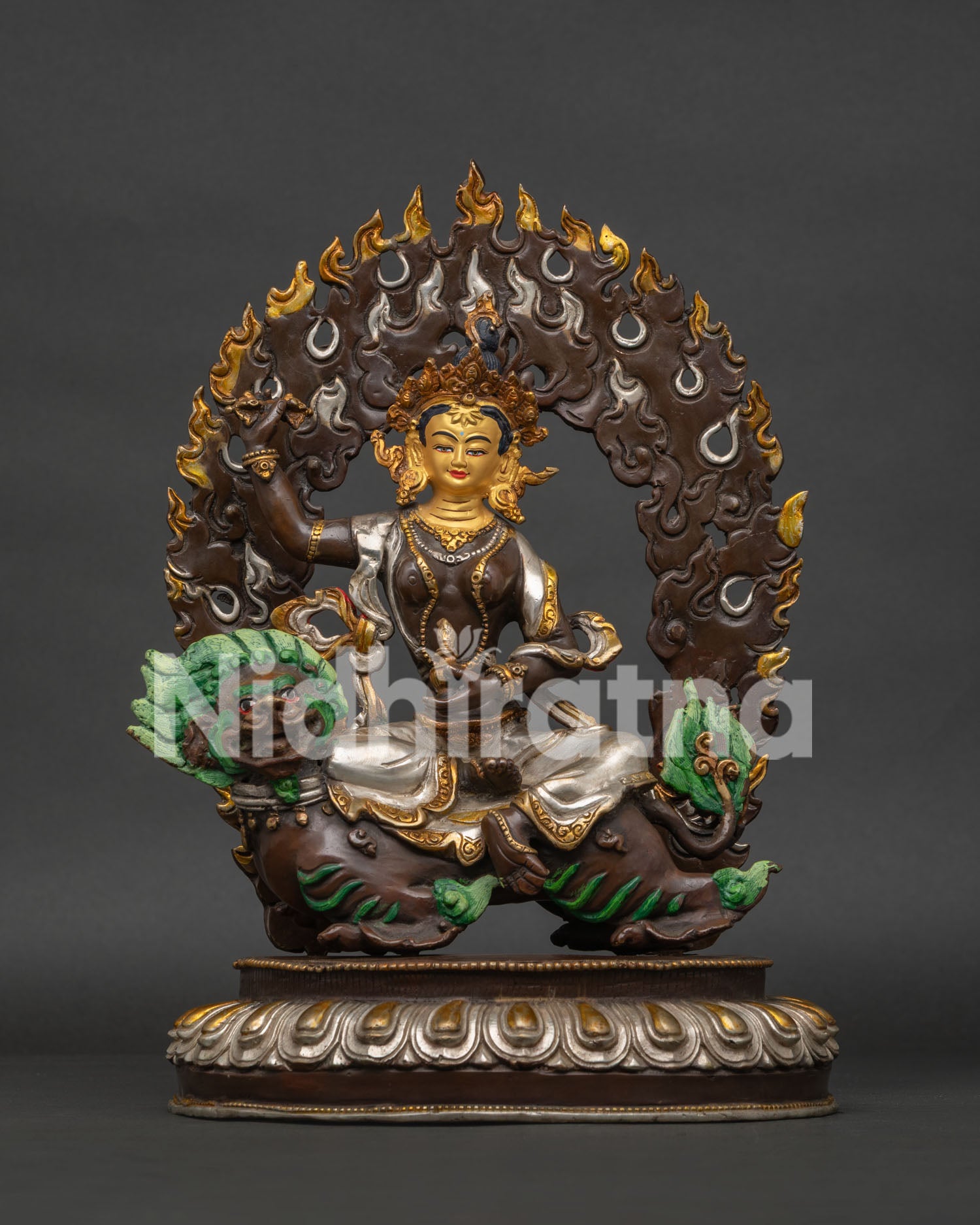 Handcrafted oxidized copper Tsheringma statue on snow lion, front view.