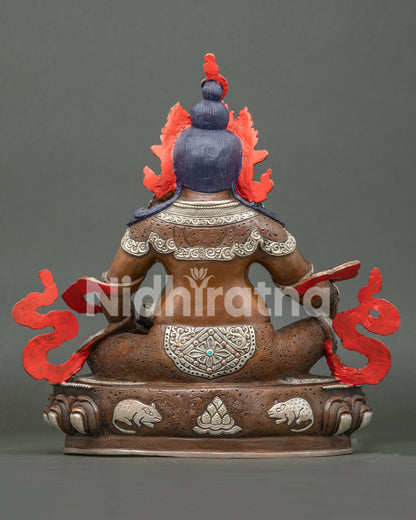 Handcrafted Oxidized Jambhala statue back view showing engraved lotus base with mongoose and jewel details
