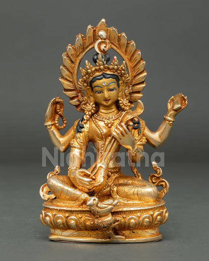 Handcrafted Saraswati Statue from Patan Nepal with gold gilded copper body and gold painted face.