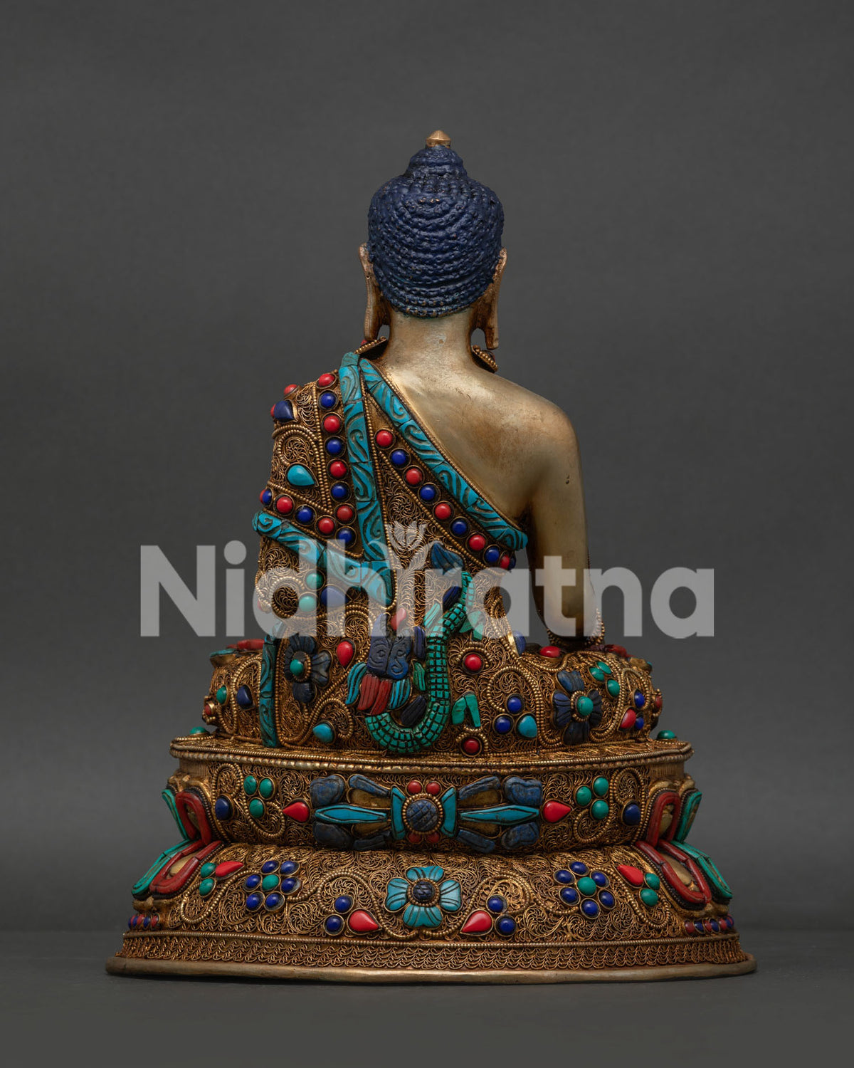 Handcrafted Shakyamuni Buddha sculpture adorned with turquoise coral and lapis lazuli