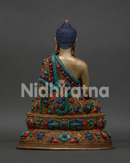 Handcrafted Shakyamuni Buddha sculpture adorned with turquoise coral and lapis lazuli