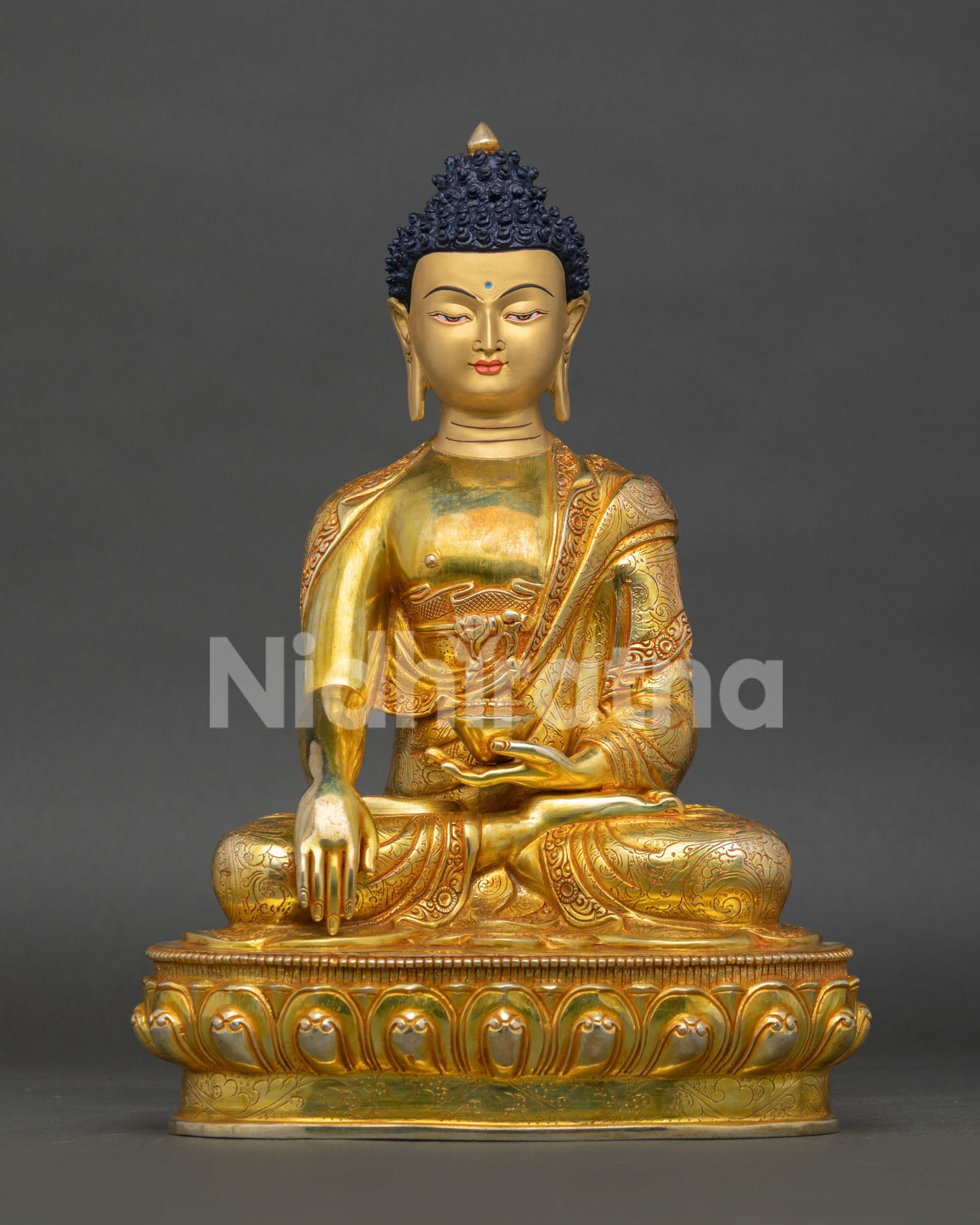 handcrafted shakyamuni buddha statue from nepal with gold gilding and lotus throne