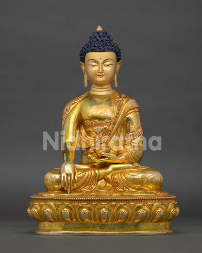 handcrafted shakyamuni buddha statue from nepal with gold gilding and lotus throne