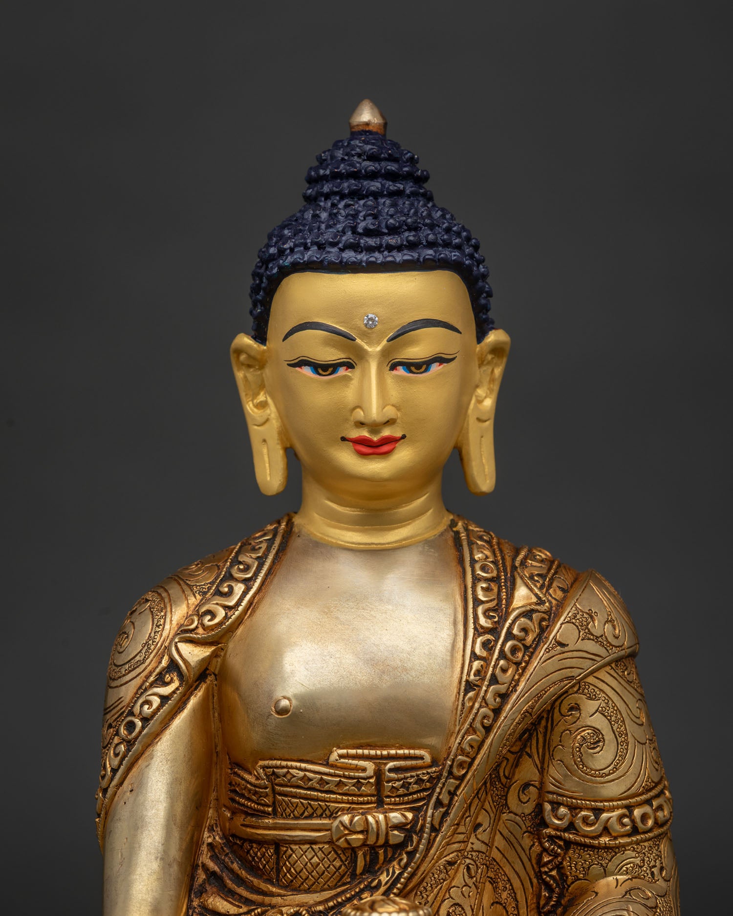 Handcrafted Shakyamuni Buddha statue from Patan Nepal with 24K gold painted face.