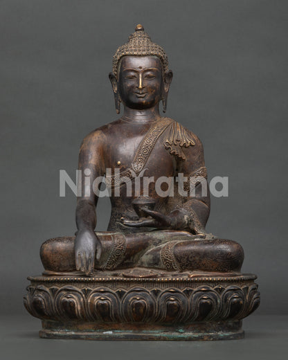 Handcrafted Shakyamuni Buddha statue from Patan Nepal with oxidized antique copper finish.