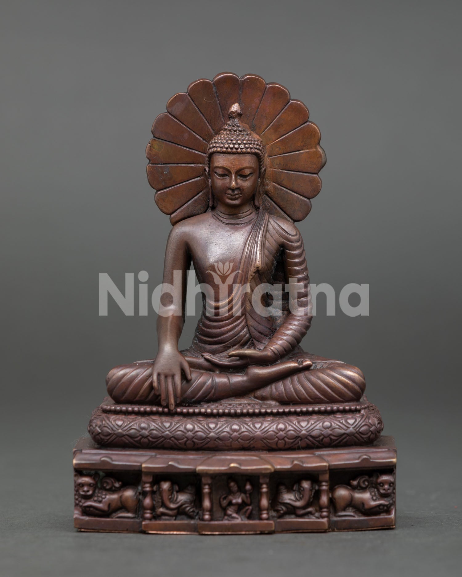Handcrafted Shakyamuni Buddha Statue from Patan Nepal with oxidized copper finish lion throne and radiant halo.