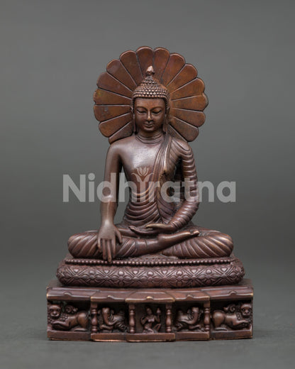 Handcrafted Shakyamuni Buddha Statue from Patan Nepal with oxidized copper finish lion throne and radiant halo.