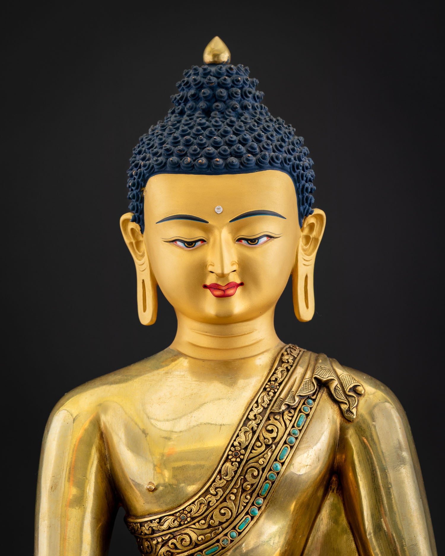 Handcrafted Shakyamuni Buddha statue front view showing gold Kasaya robe and serene painted face