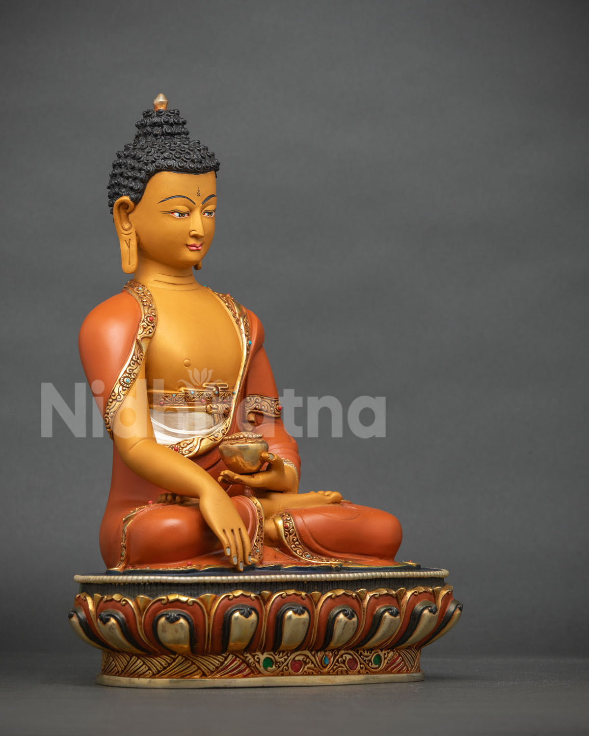 Handcrafted Shakyamuni Buddha statue in Bhumisparsha Mudra, side view on a lotus pedestal
