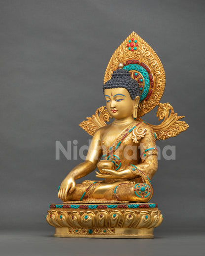 Handcrafted Shakyamuni Buddha statue in earth-touching mudra, angled view with gold fire gilding