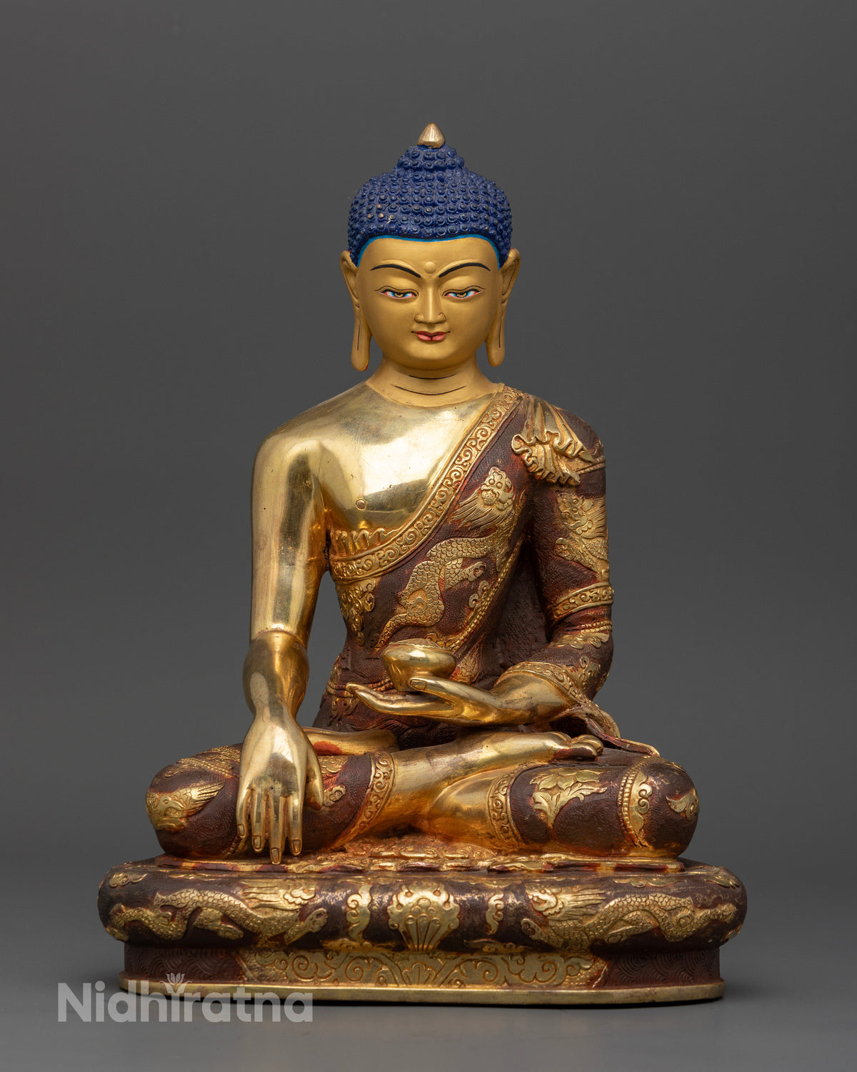 Handcrafted Shakyamuni Buddha statue in gold gilded copper from Patan Nepal.