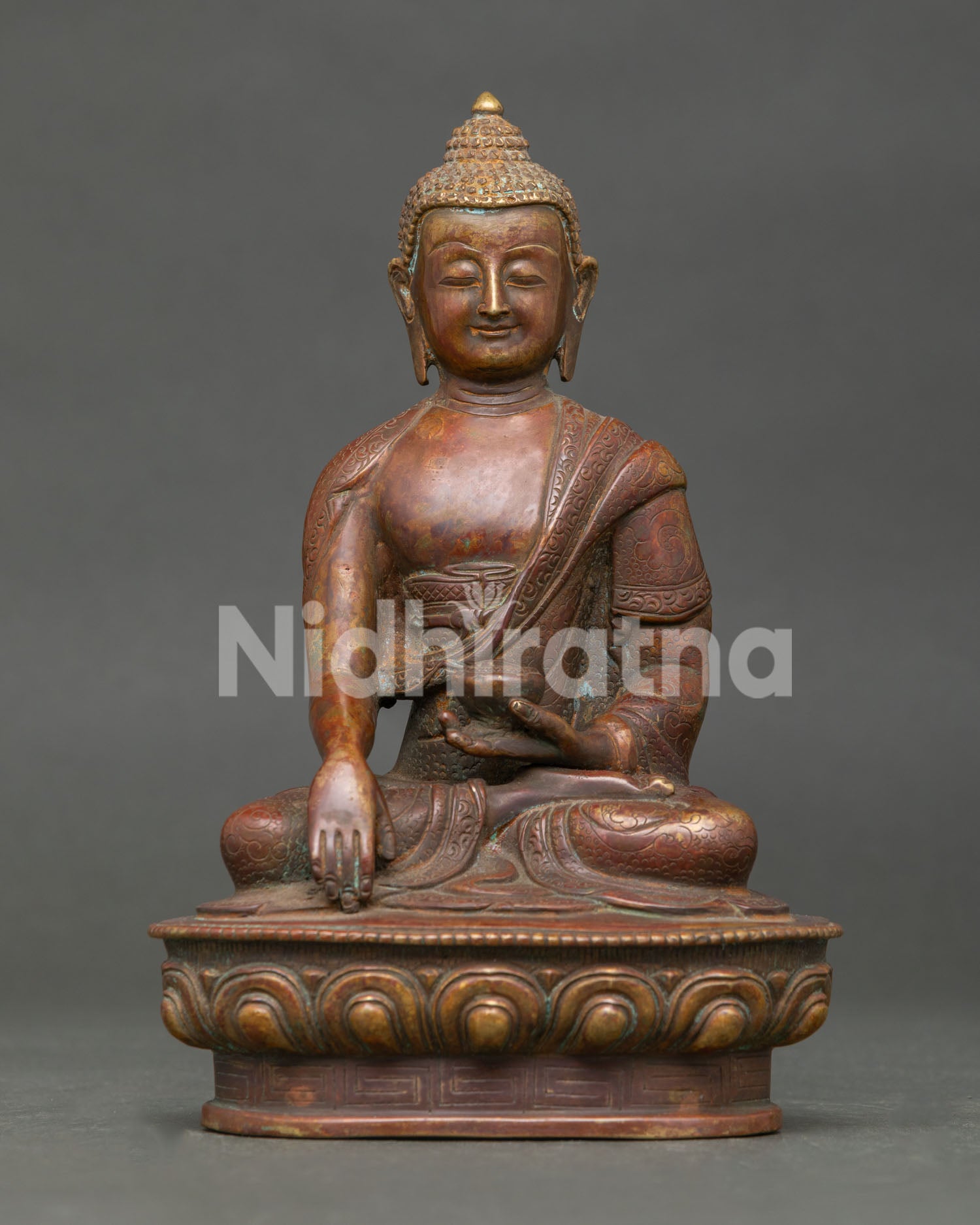 Handcrafted Shakyamuni Buddha Statue in Oxidized Copper Seated on Lotus Pedestal from Nepal.