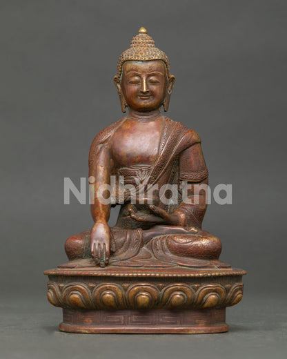 Handcrafted Shakyamuni Buddha Statue in Oxidized Copper Seated on Lotus Pedestal from Nepal.