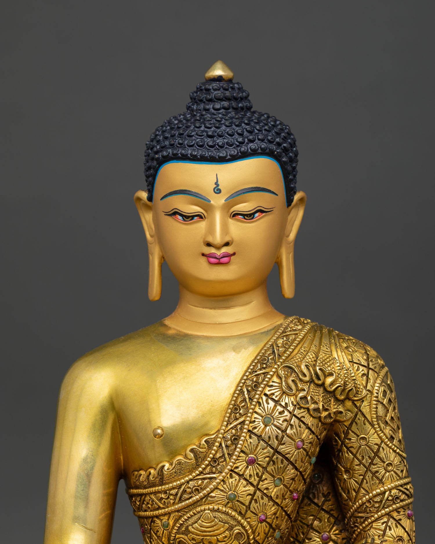 Handcrafted Shakyamuni Buddha statue with gold gilded details and traditional Nepalese craftsmanship