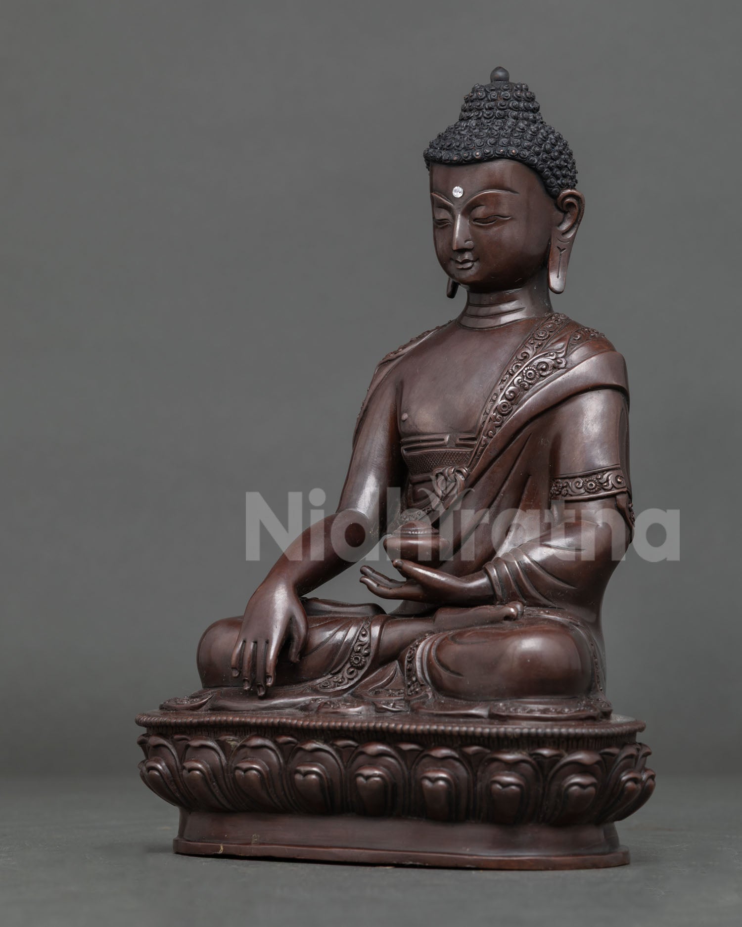 Handcrafted shakyamuni buddha statue with oxidized copper finish from patan nepal.