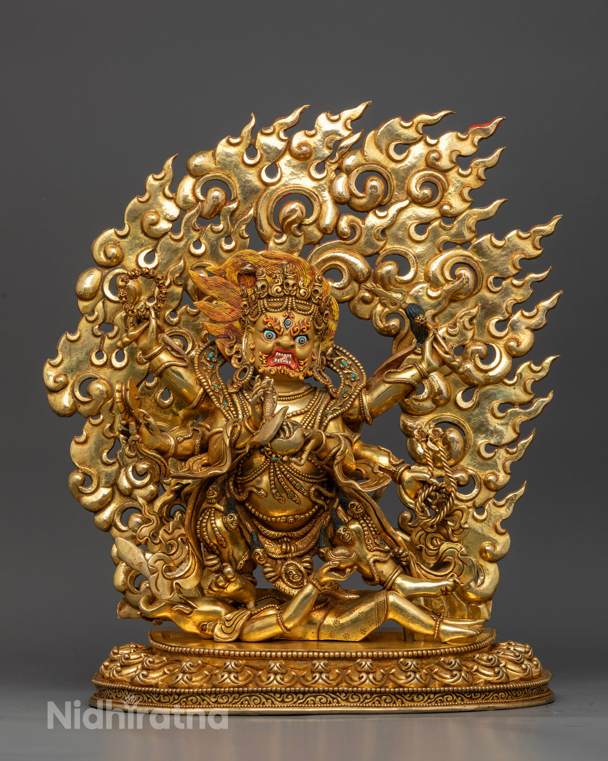 Handcrafted Six-Armed Mahakala statue in gold gilded copper from Patan Nepal.