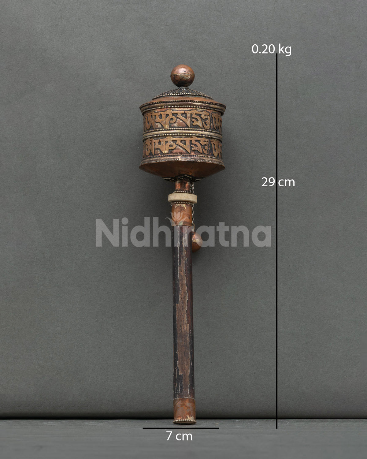 Handcrafted Tibetan Buddhist prayer wheel in silver plated copper from Patan Nepal.