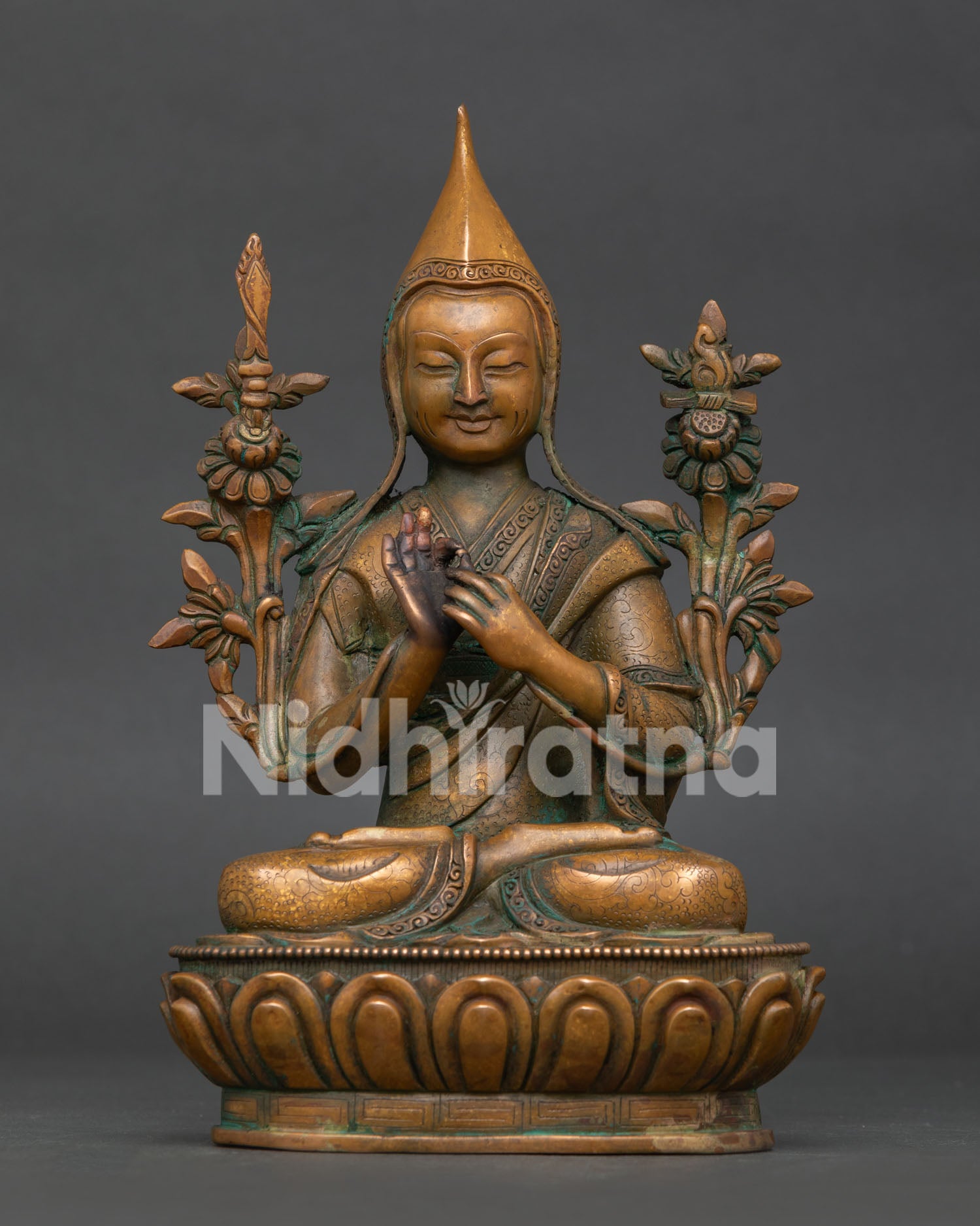 Handcrafted tsongkhapa statue in oxidized copper with lotus pedestal and dharmachakra mudra front view.