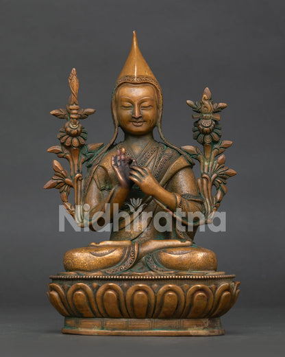Handcrafted tsongkhapa statue in oxidized copper with lotus pedestal and dharmachakra mudra front view.